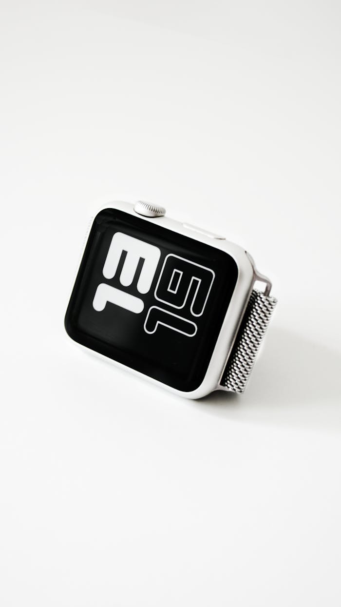 Sleek smartwatch with monochrome digital design on a white background.